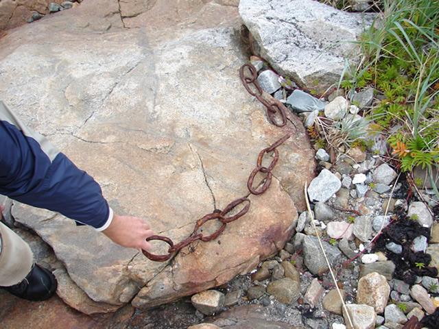 A old forged-iron chain, on the shore at Frenchman's Cove.